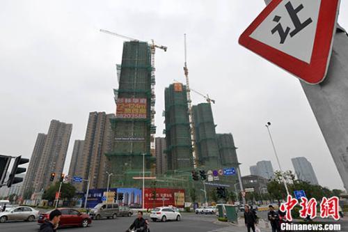 資料圖：商品房在建中。 <a target='_blank'  _fcksavedurl='http://www.chinanews.com/'>中新社</a>記者 呂明 攝